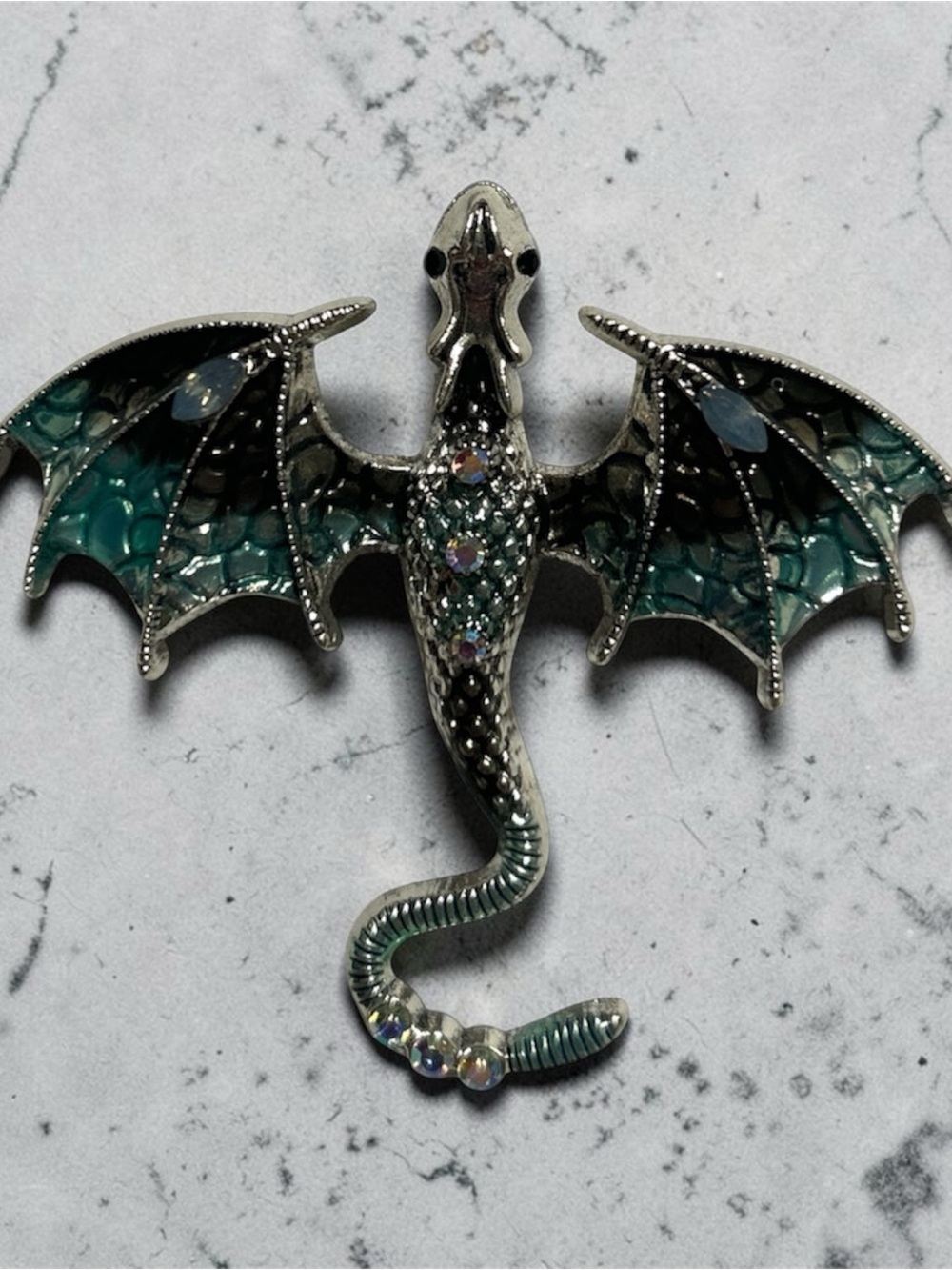 Silver Dragon Brooch with Teal-Green Wing Accents